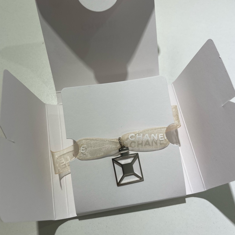 CHANEL Silver Geometric Pendant on Ivory Ribbon